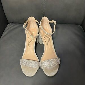 Nina silver shiny shoes, Size7. Ankle strap and block heel. Some stones missing.